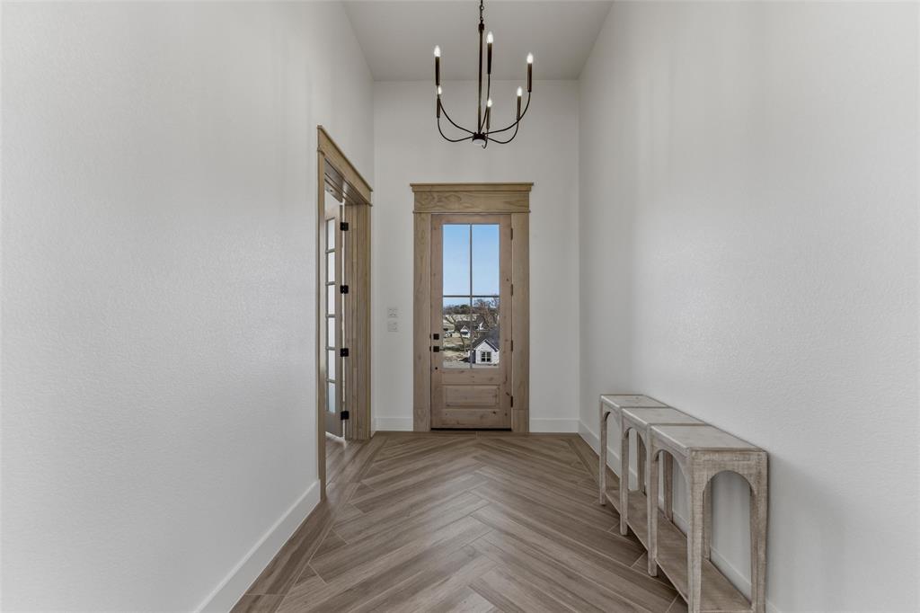 1038 Deer Island Azle, TX 76020 - Photo 8 of 32 a view of a hallway with wooden floor and staircase
