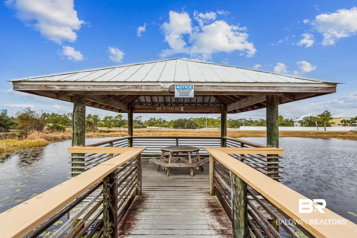 13551 Johnson Beach Road, Unit 112E Pensacola, FL 32507 - Photo 31 of 42 View of dock featuring a water view and a gazebo