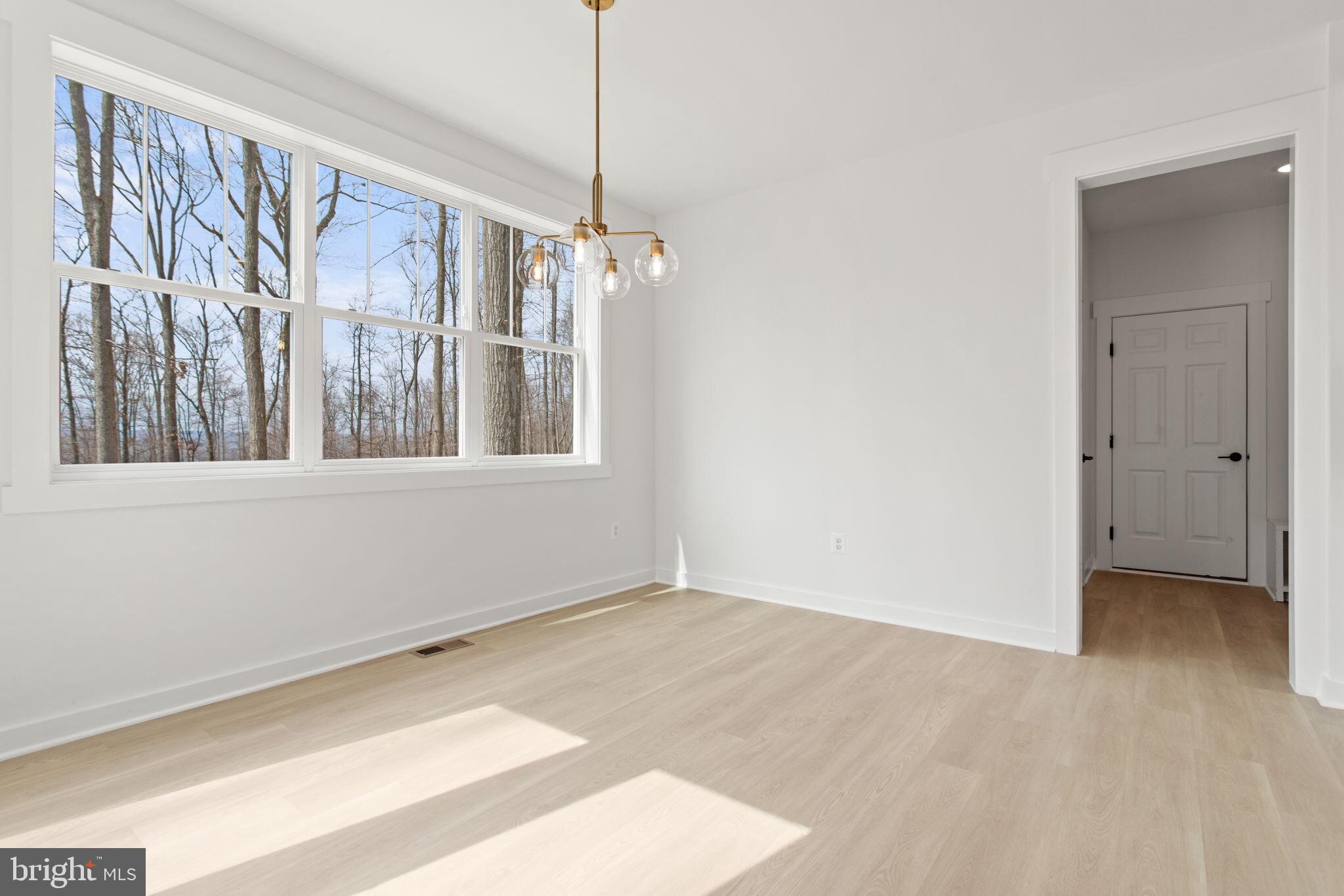 6512 Shady Side Road Shady Side, MD 20764 - Photo 18 of 29 a view of an empty room with a window