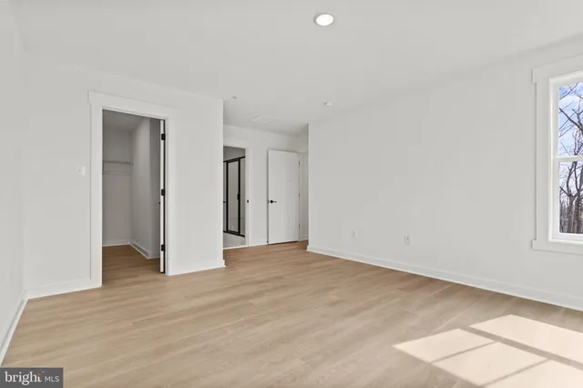 a view of a bathroom from a hallway