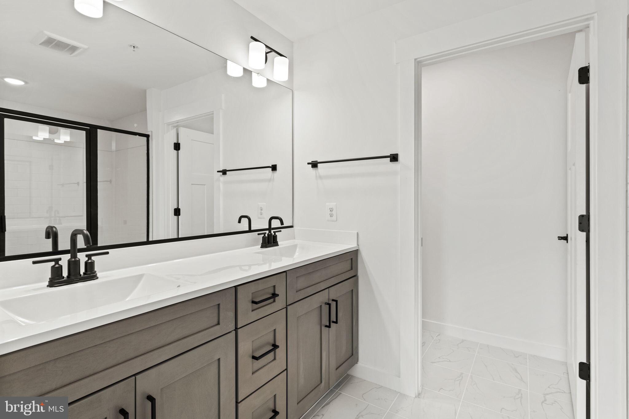 6512 Shady Side Road Shady Side, MD 20764 - Photo 23 of 29 a bathroom with a sink and a mirror