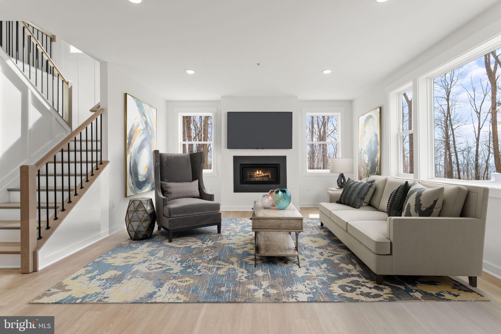 6512 Shady Side Road Shady Side, MD 20764 - Photo 25 of 29 a living room with furniture and a fireplace