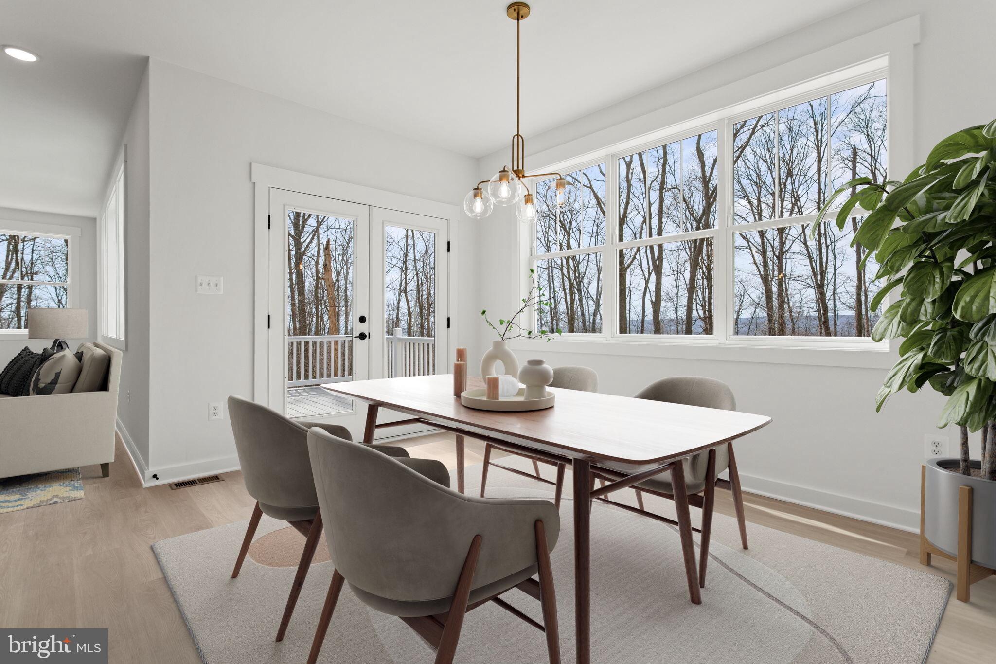 6512 Shady Side Road Shady Side, MD 20764 - Photo 27 of 29 a view of a dining room with furniture window and wooden floor