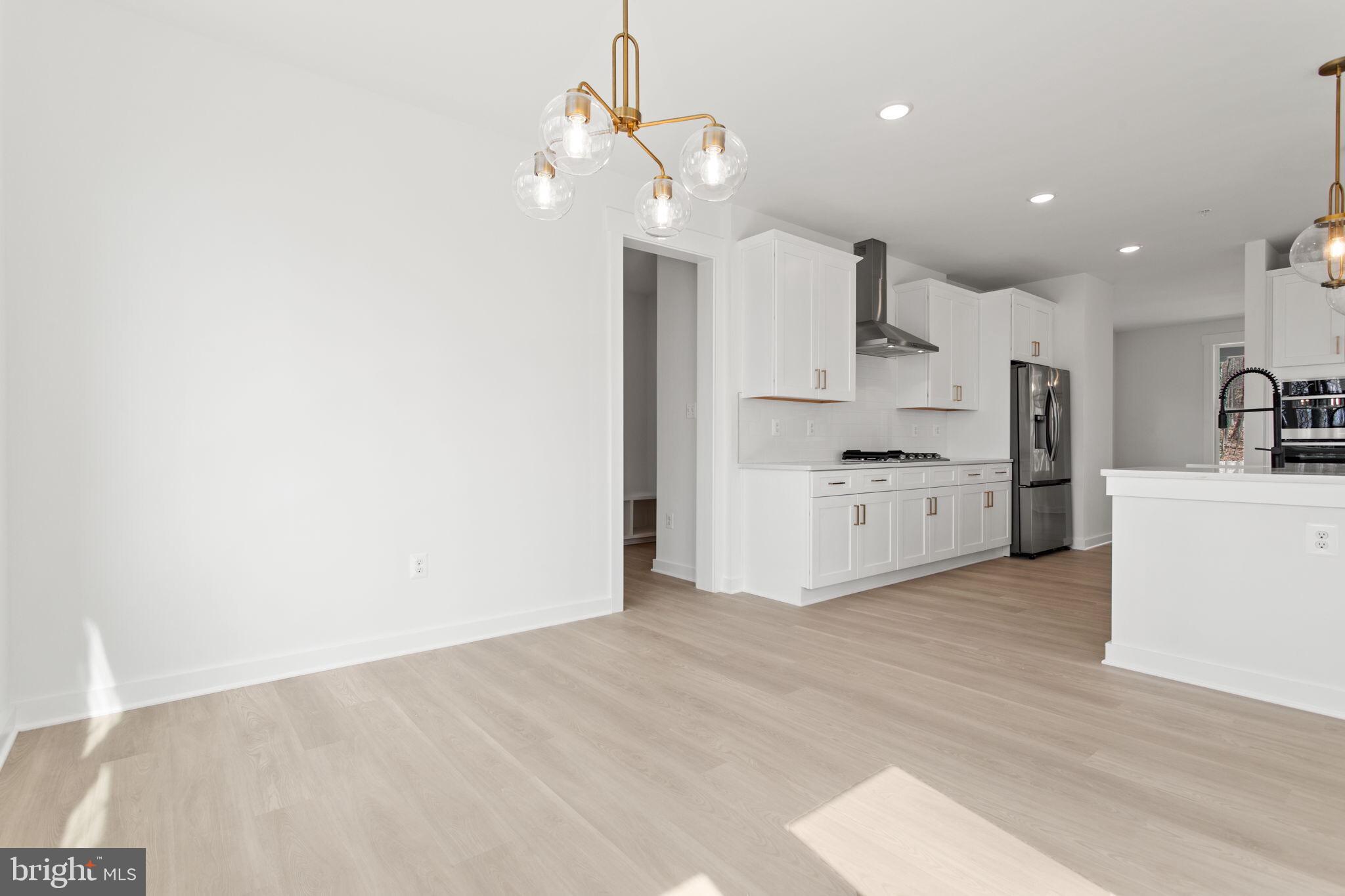 6512 Shady Side Road Shady Side, MD 20764 - Photo 6 of 29 a view of a kitchen with electric appliances