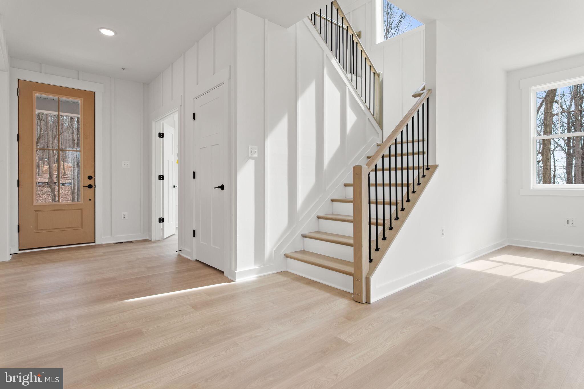 6512 Shady Side Road Shady Side, MD 20764 - Photo 9 of 29 a view of a hallway with staircase