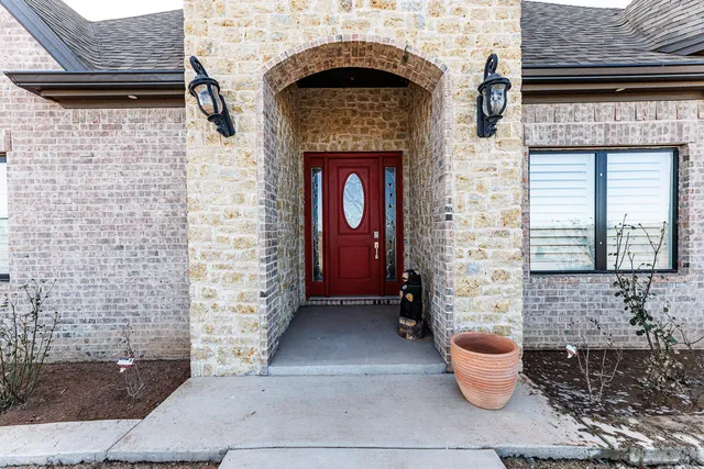 a kitchen with stainless steel appliances a refrigerator and a stove top oven