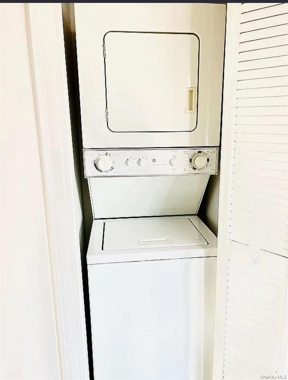 43-18 Main Street, Unit 7F Queens, NY 11355 - Photo 6 of 11 a utility room with dryer and washer