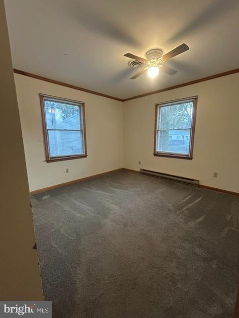 20 Ruth Street Selbyville, DE 19975 - Photo 11 of 19 an empty room with windows and fan