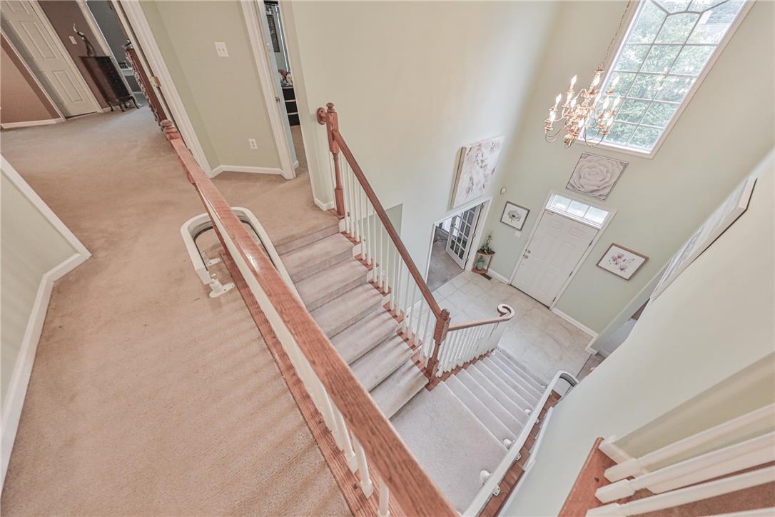 138 Clover Hollow Road Easton, PA 18045 - Photo 58 of 95 An inviting entry showcases a grand staircase and abundant natural light from a soaring window.