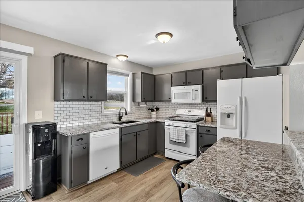 a bedroom with a bed and a ceiling fan