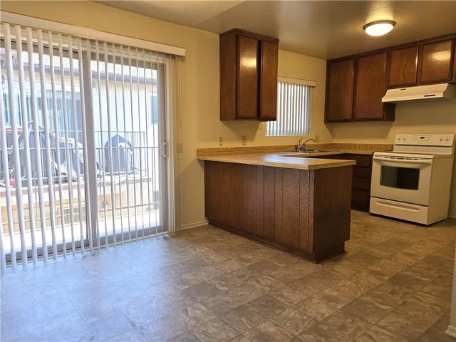a kitchen with a stove and a sink
