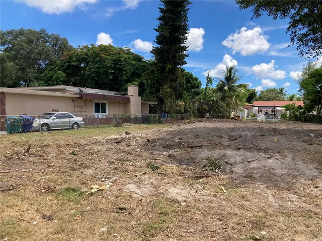 a row of car parked in front of house