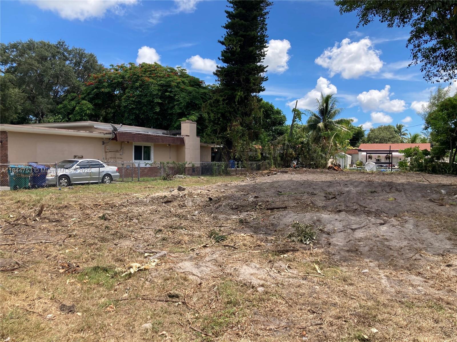 0 Northeast 149th Miami, FL 33161 - Photo 2 of 5 a row of car parked in front of house