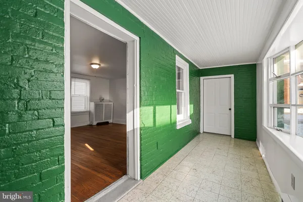 a white toilet sitting next to a white walls