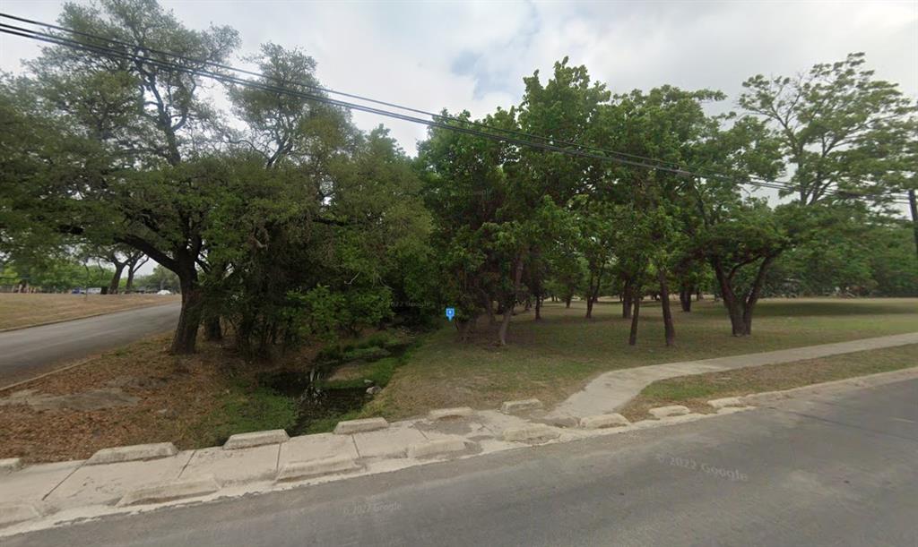 1310 2nd Street Kerrville, TX 78028 - Photo 2 of 5 a swimming pool with trees in the background