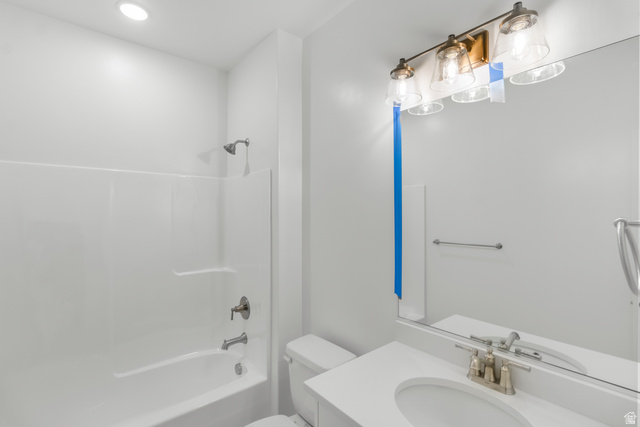 537 South Rivergate Drive Logan, UT 84321 - Photo 13 of 20 Contemporary bathroom featuring a white vanity with an integrated sink, brushed nickel faucet, and a large mirror