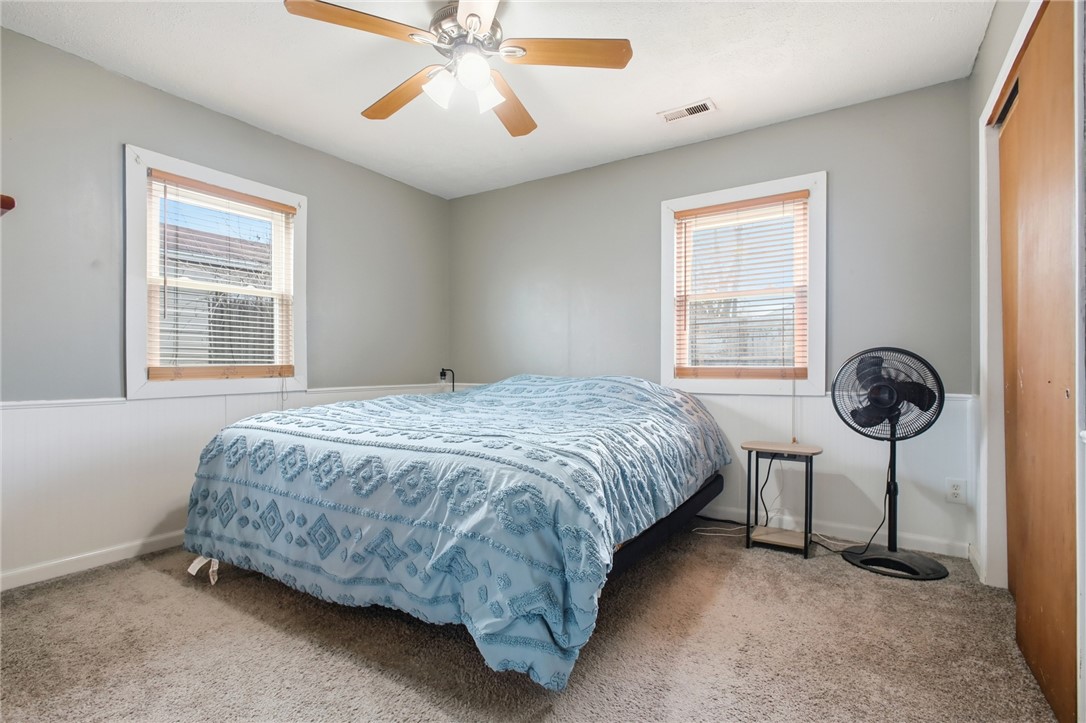 2745 Share Street Springfield, OH 45505 - Photo 17 of 28 This tranquil bedroom features carpeted floors, bright windows, and a ceiling fan for comfort.