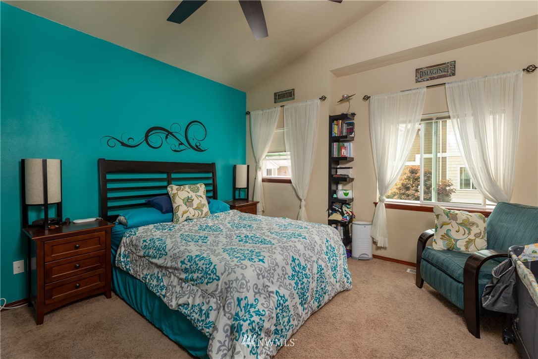1057 215th Place Southeast Bothell, WA 98021 - Photo 14 of 26 a bedroom with a bed and furniture with the outer view