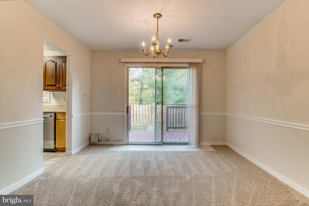 7732 Matisse Way Springfield, VA 22153 - Photo 11 of 30 a view of an empty room with a window