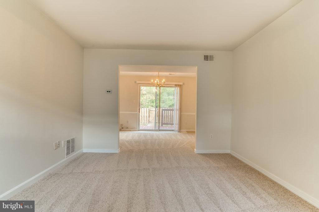 7732 Matisse Way Springfield, VA 22153 - Photo 12 of 30 a view of an empty room and window