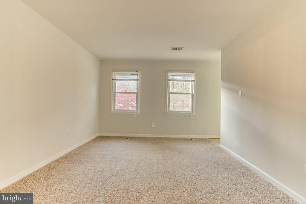 7732 Matisse Way Springfield, VA 22153 - Photo 13 of 30 an empty room with windows