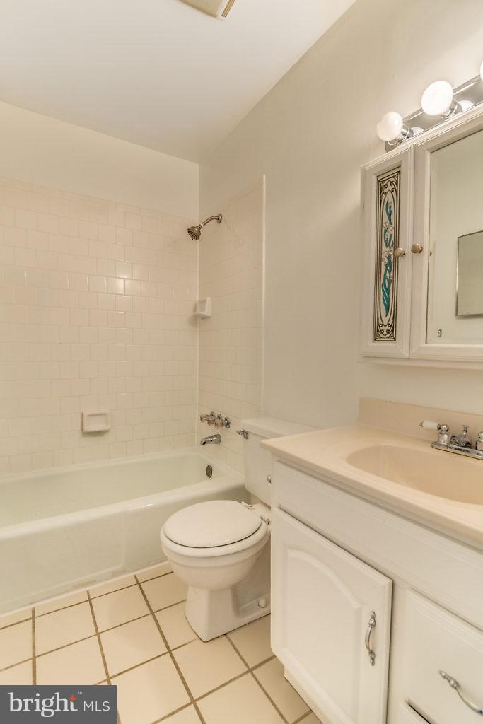 7732 Matisse Way Springfield, VA 22153 - Photo 20 of 30 a bathroom with a sink a toilet and shower