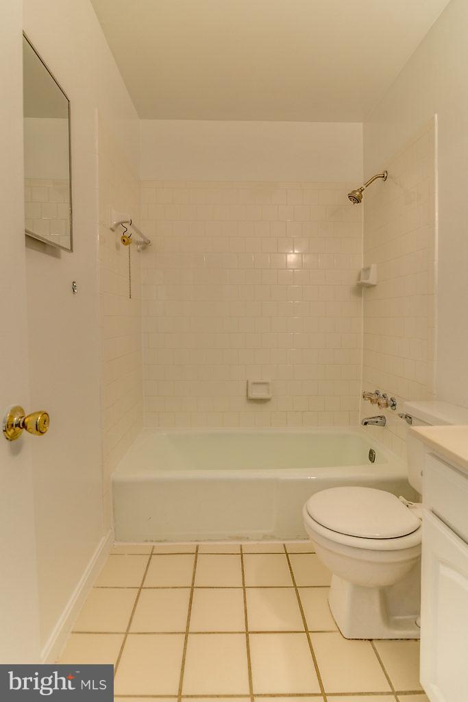 7732 Matisse Way Springfield, VA 22153 - Photo 21 of 30 a bathroom with a toilet a sink and shower