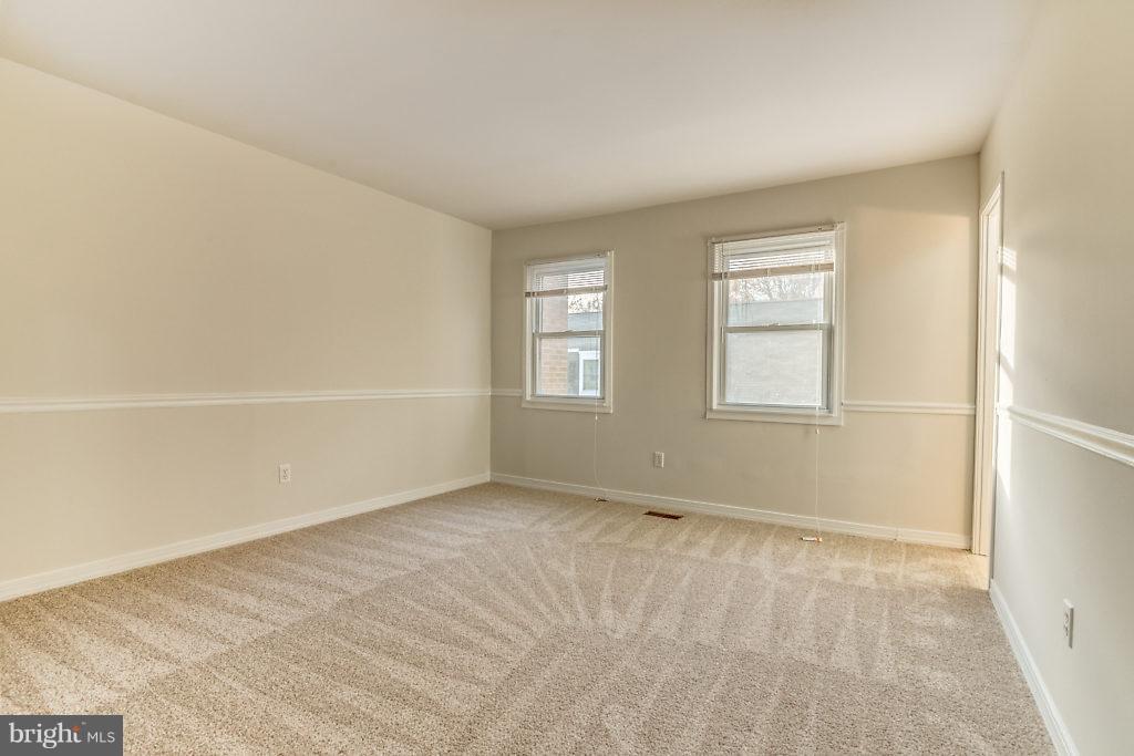 7732 Matisse Way Springfield, VA 22153 - Photo 22 of 30 an empty room with windows