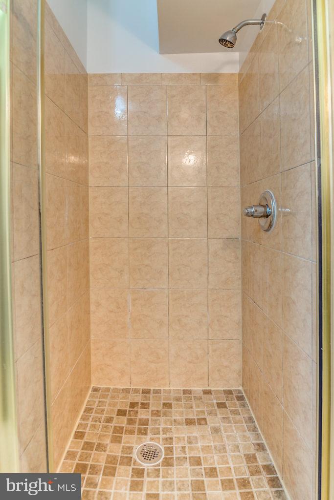 7732 Matisse Way Springfield, VA 22153 - Photo 26 of 30 a bathroom with a shower