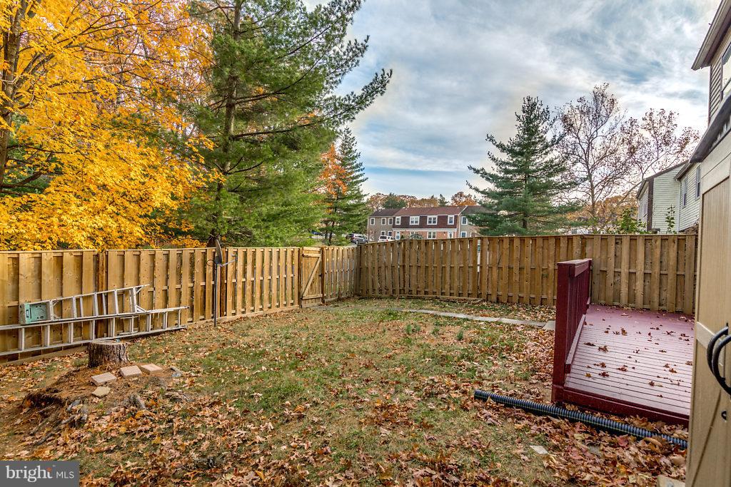 7732 Matisse Way Springfield, VA 22153 - Photo 29 of 30 a view of a backyard with wooden fence