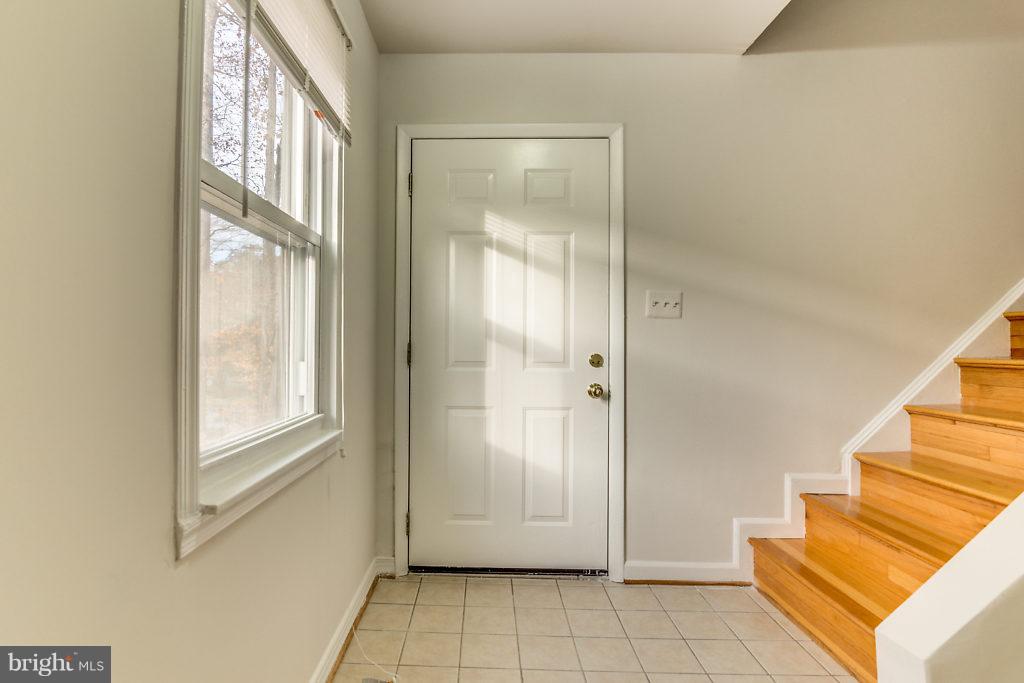 7732 Matisse Way Springfield, VA 22153 - Photo 4 of 30 a view of an entryway with staircase