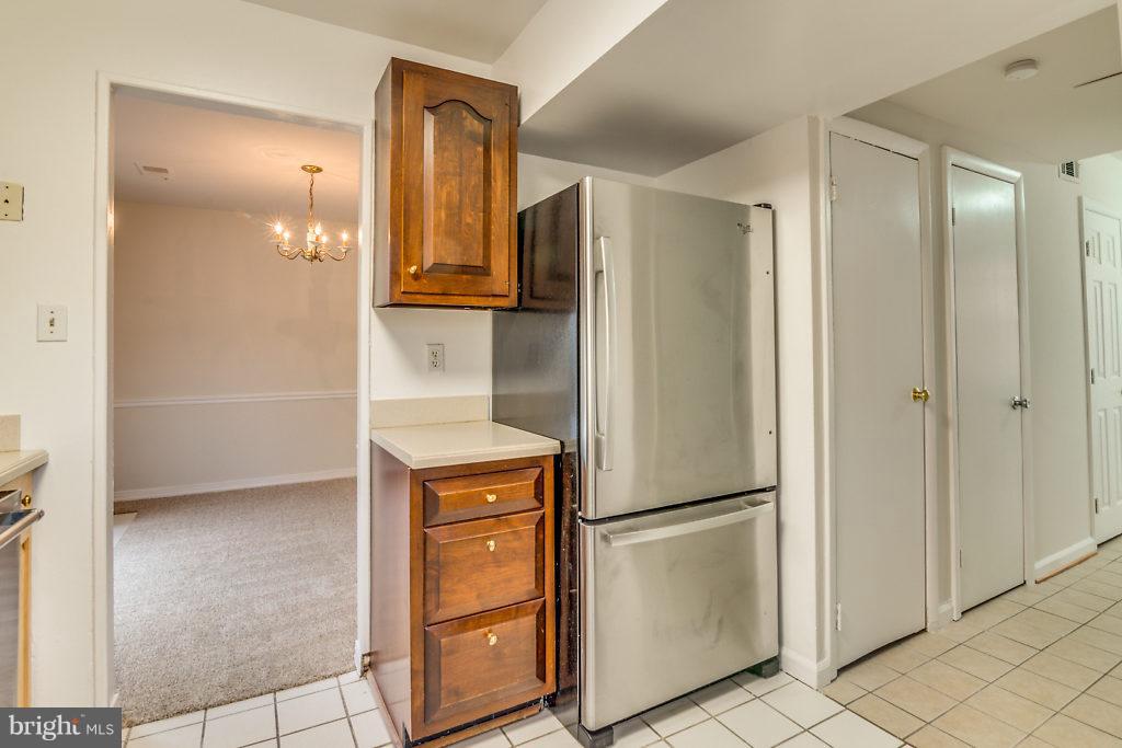 7732 Matisse Way Springfield, VA 22153 - Photo 8 of 30 a view of walk in closet with empty racks