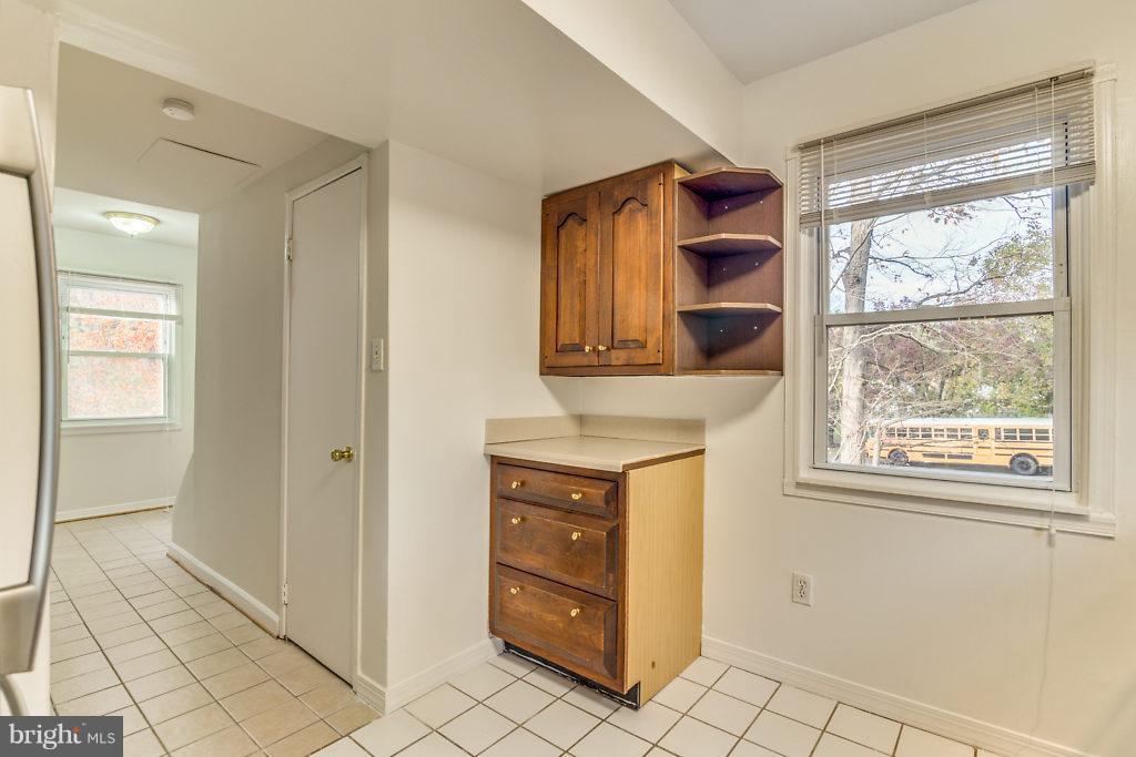 7732 Matisse Way Springfield, VA 22153 - Photo 9 of 30 a kitchen with a refrigerator and a sink