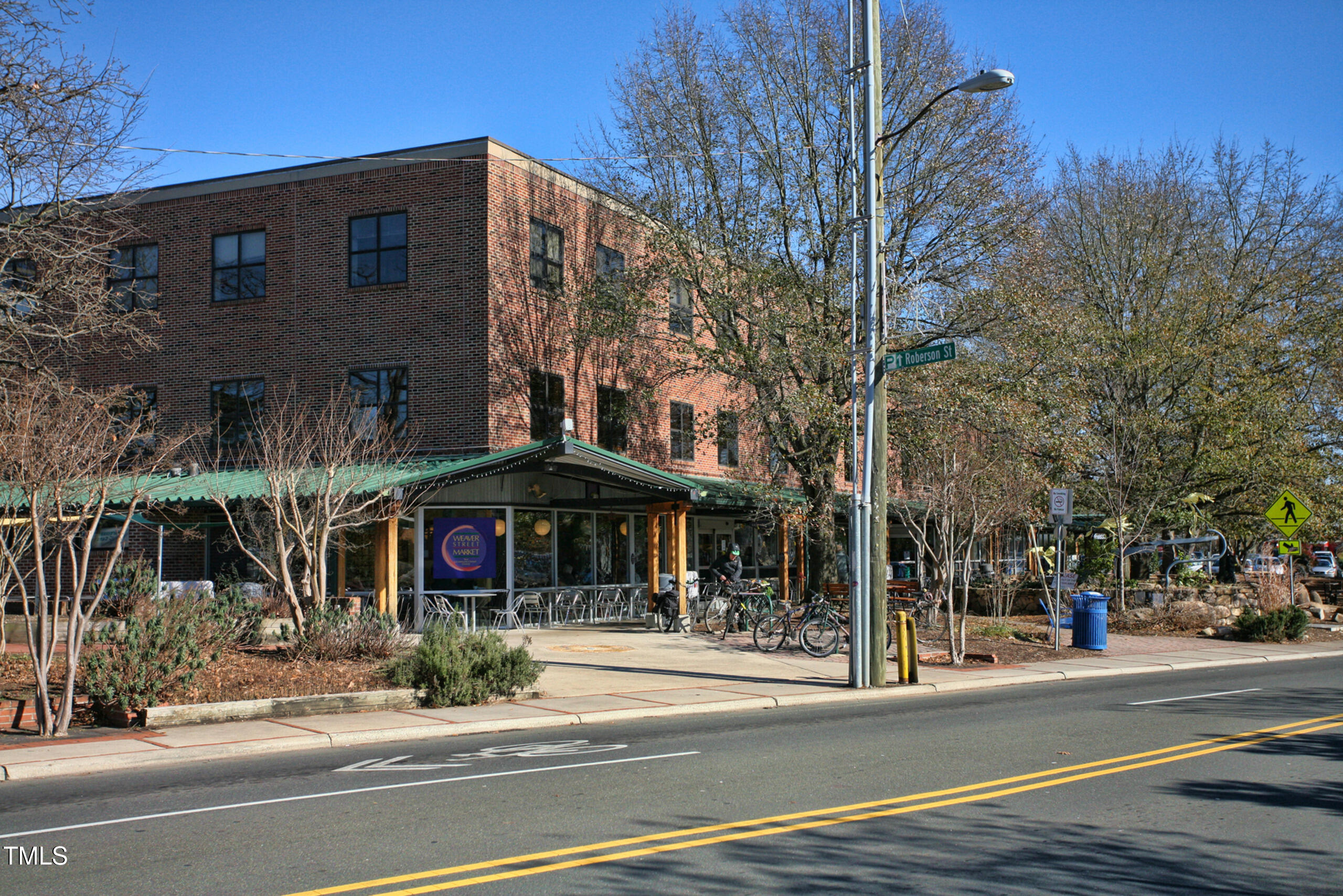 130 Two Hills Drive, Unit 102B Carrboro, NC 27510 - Photo 13 of 18 a view of a food mall next to a road