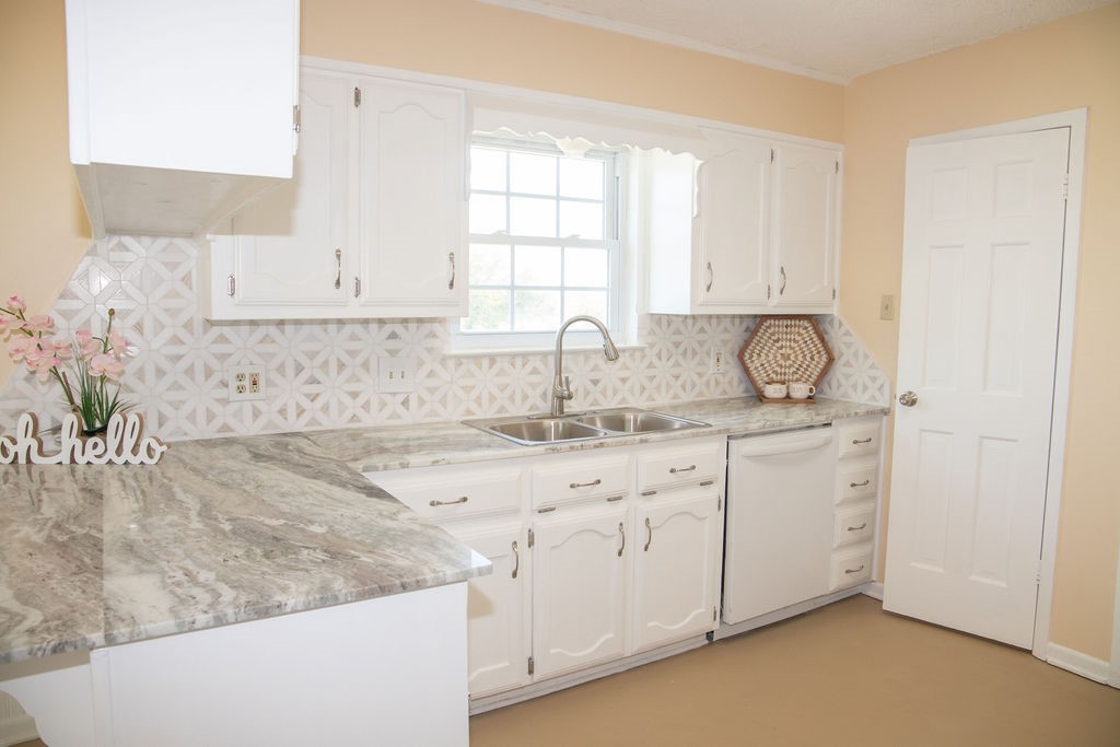 261 Rabbit Hill Lorena, TX 76655 - Photo 13 of 50 a kitchen with sink and cabinets