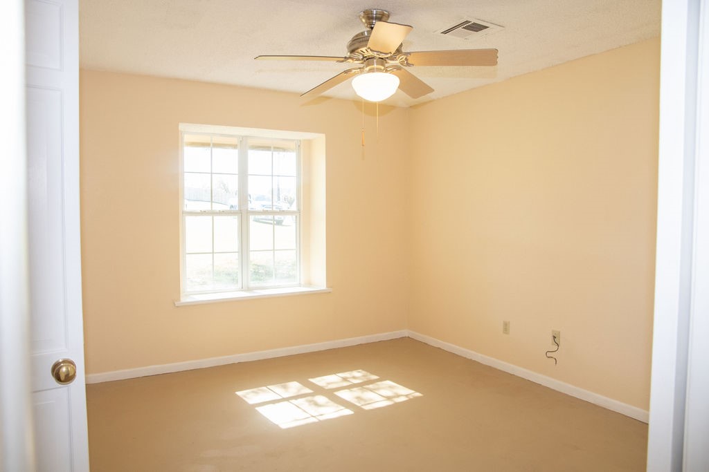 261 Rabbit Hill Lorena, TX 76655 - Photo 20 of 50 an empty room with a window and a ceiling fan