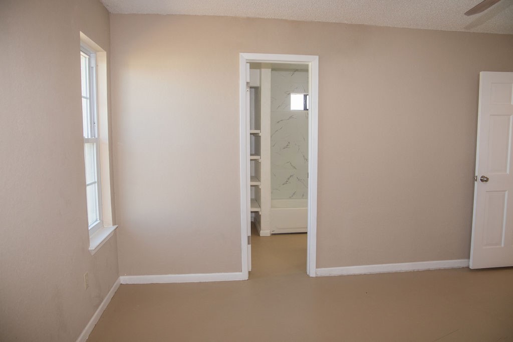 261 Rabbit Hill Lorena, TX 76655 - Photo 30 of 50 an empty room with windows and closet