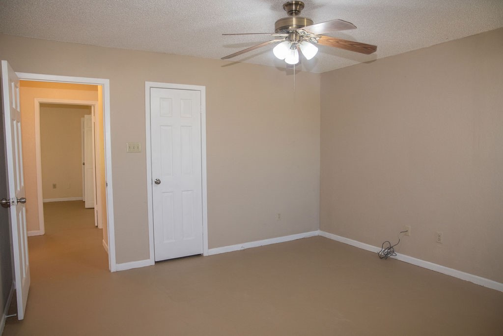 261 Rabbit Hill Lorena, TX 76655 - Photo 31 of 50 an empty room with a fan and a chandelier fan