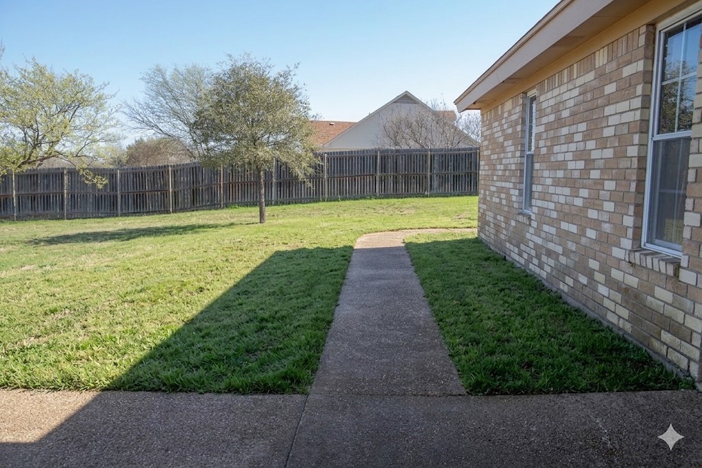 261 Rabbit Hill Lorena, TX 76655 - Photo 36 of 50 a view of a backyard with a garden