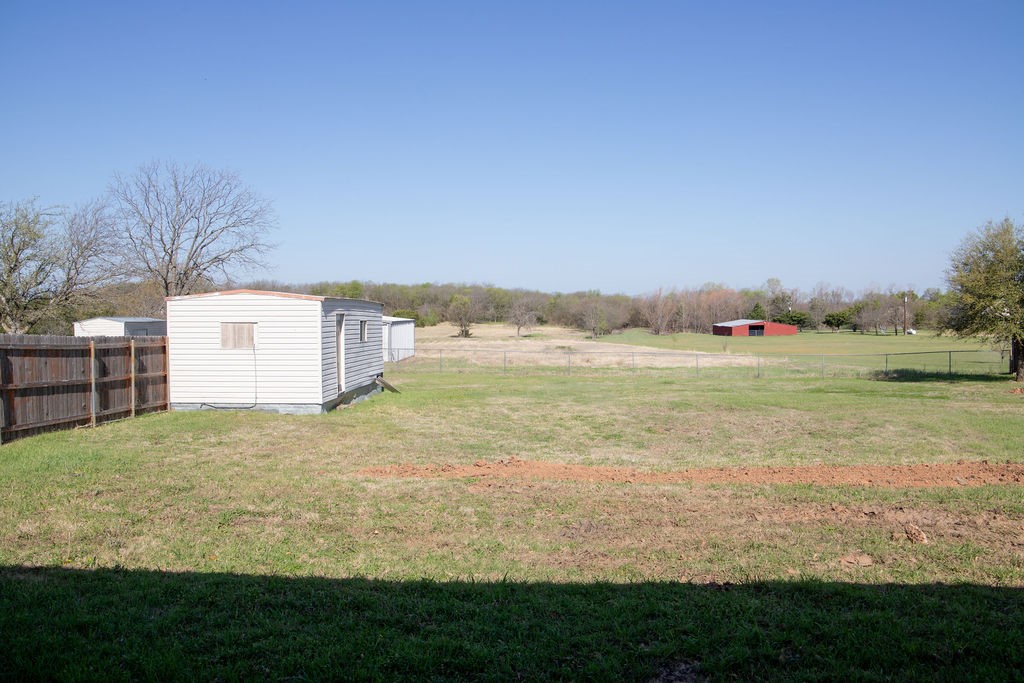 261 Rabbit Hill Lorena, TX 76655 - Photo 39 of 50 a view of a field with an ocean and trees