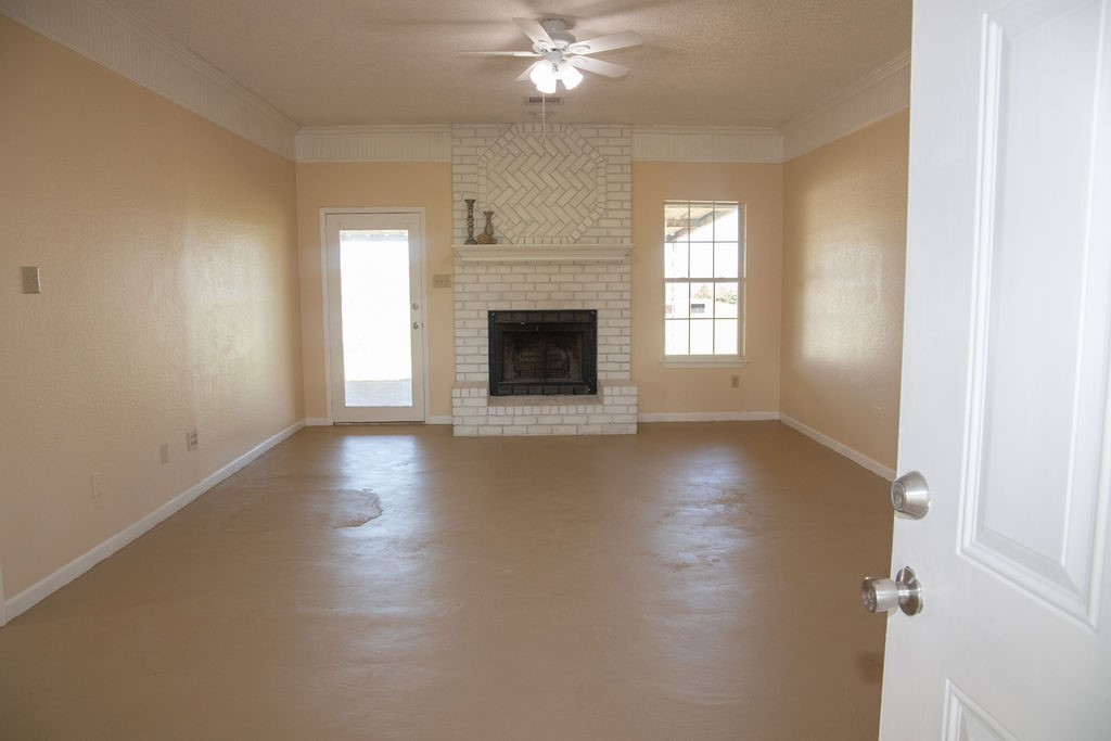 261 Rabbit Hill Lorena, TX 76655 - Photo 5 of 50 a view of a livingroom with a fireplace window and wooden floor