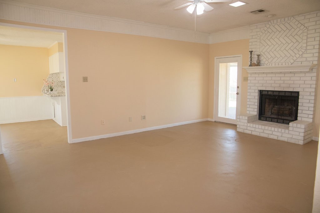 261 Rabbit Hill Lorena, TX 76655 - Photo 7 of 50 a view of a livingroom with wooden floor and a fireplace