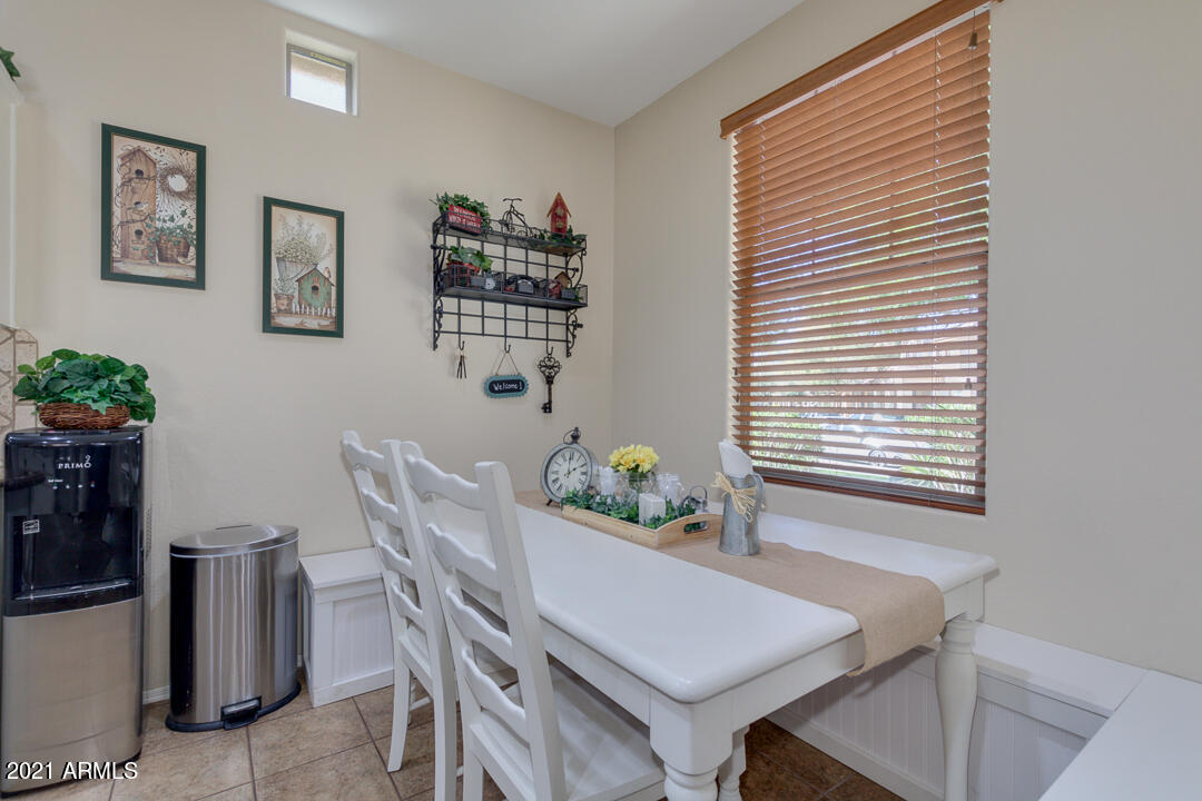 3763 East Larson Lane Gilbert, AZ 85295 - Photo 12 of 40 a view of a room that has a table and a chair in it