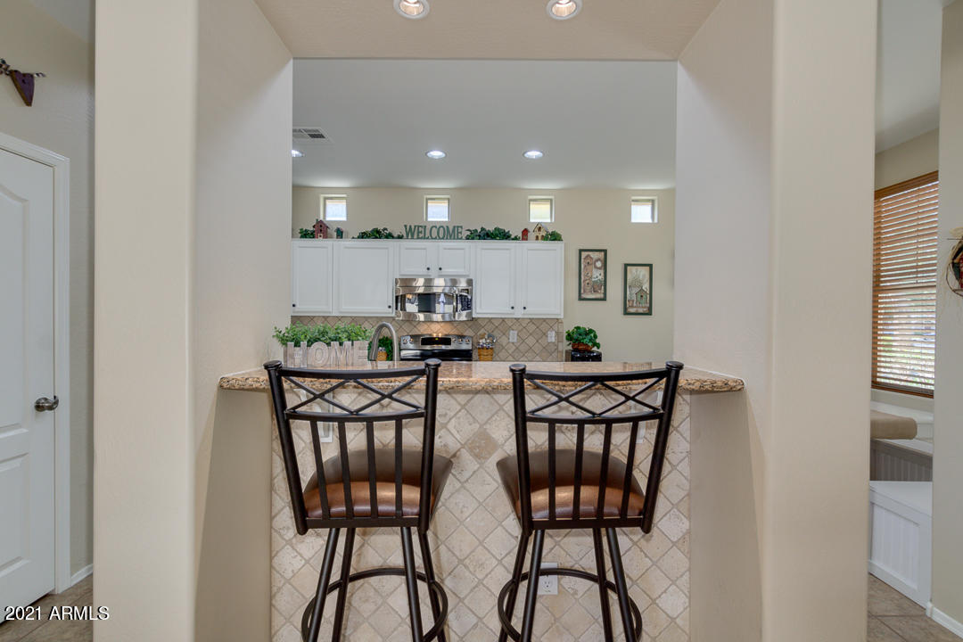 3763 East Larson Lane Gilbert, AZ 85295 - Photo 14 of 40 a view of a dining room with furniture and window