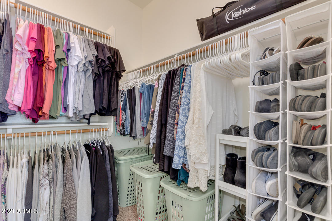3763 East Larson Lane Gilbert, AZ 85295 - Photo 28 of 40 a view of walk in closet with clothes and shoes