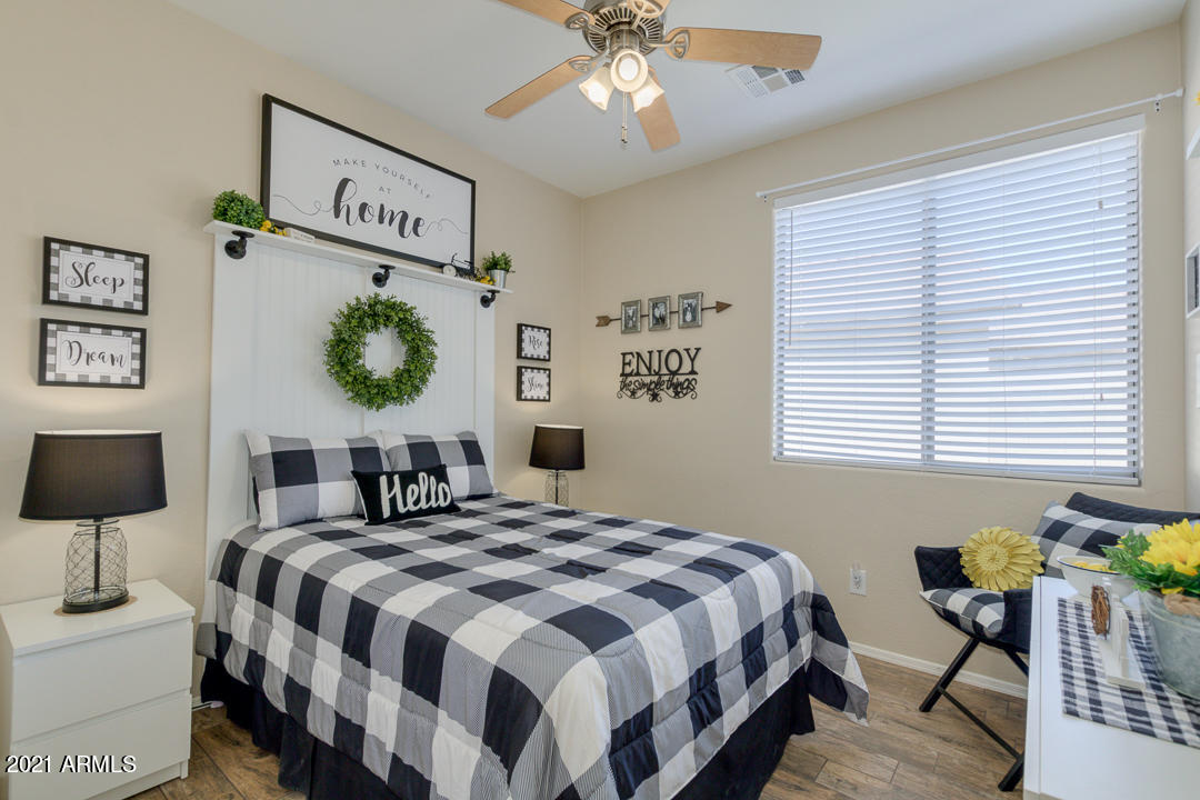 3763 East Larson Lane Gilbert, AZ 85295 - Photo 29 of 40 a bedroom with a bed and a table in it