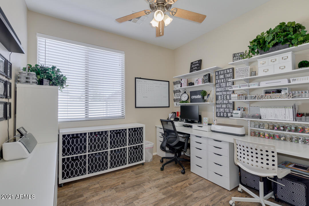 3763 East Larson Lane Gilbert, AZ 85295 - Photo 31 of 40 a bedroom with furniture a chandelier and a window