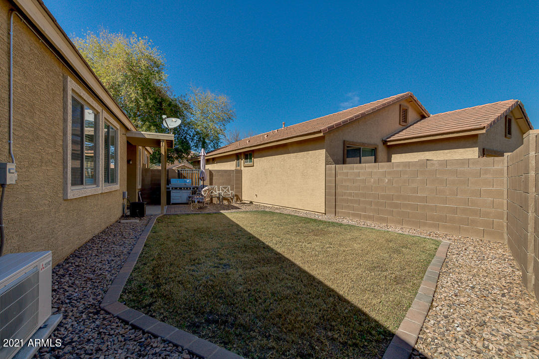 3763 East Larson Lane Gilbert, AZ 85295 - Photo 35 of 40 a view of a front of house with a yard
