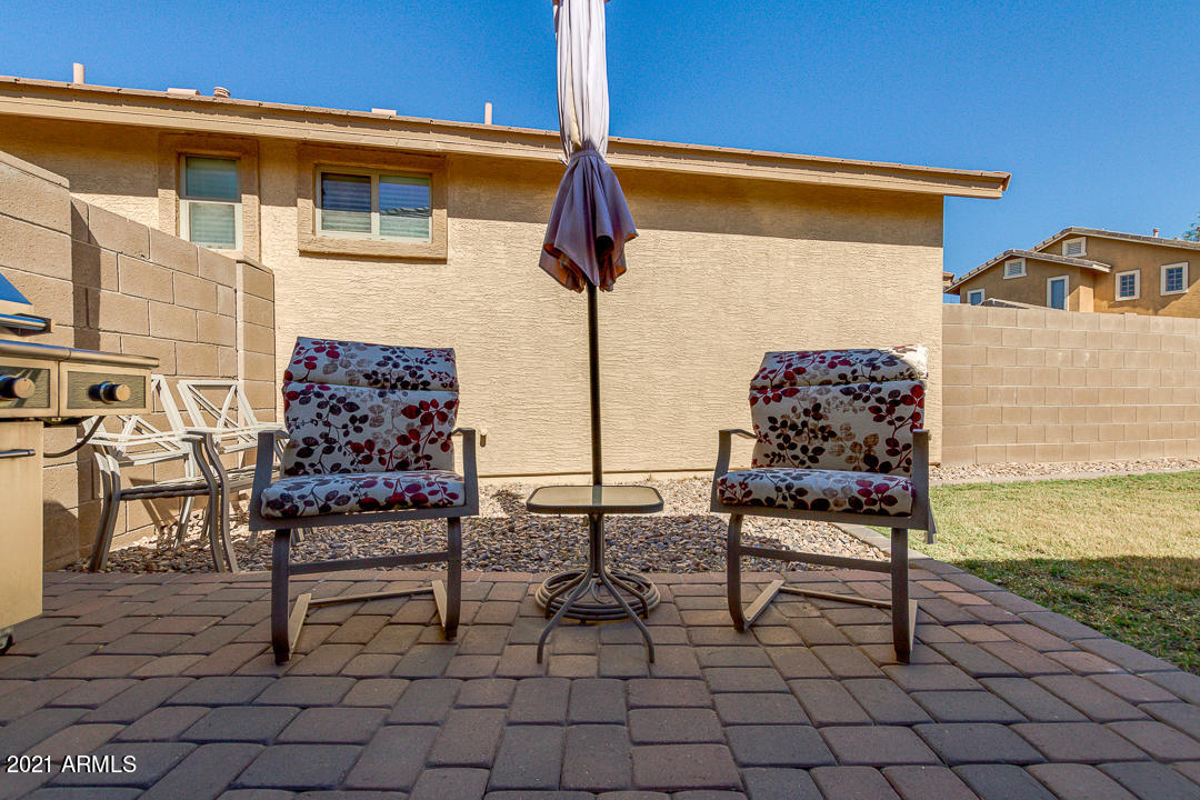3763 East Larson Lane Gilbert, AZ 85295 - Photo 39 of 40 a outdoor space with a bench and white walls