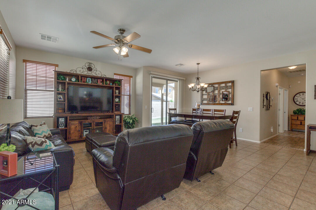 3763 East Larson Lane Gilbert, AZ 85295 - Photo 5 of 40 a living room with furniture and a flat screen tv